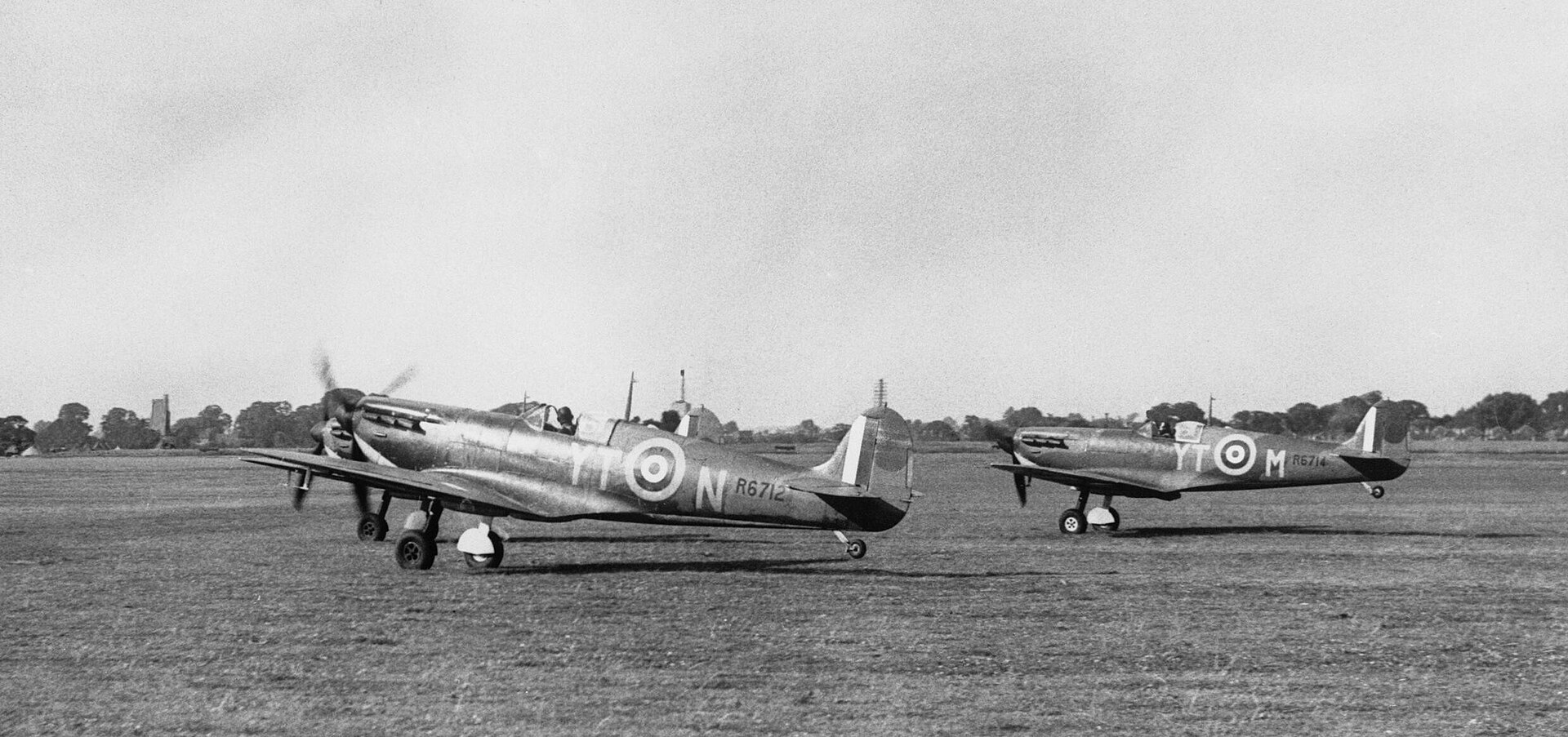 Three Spitfire fighters on an airfield during the Battle of Britain